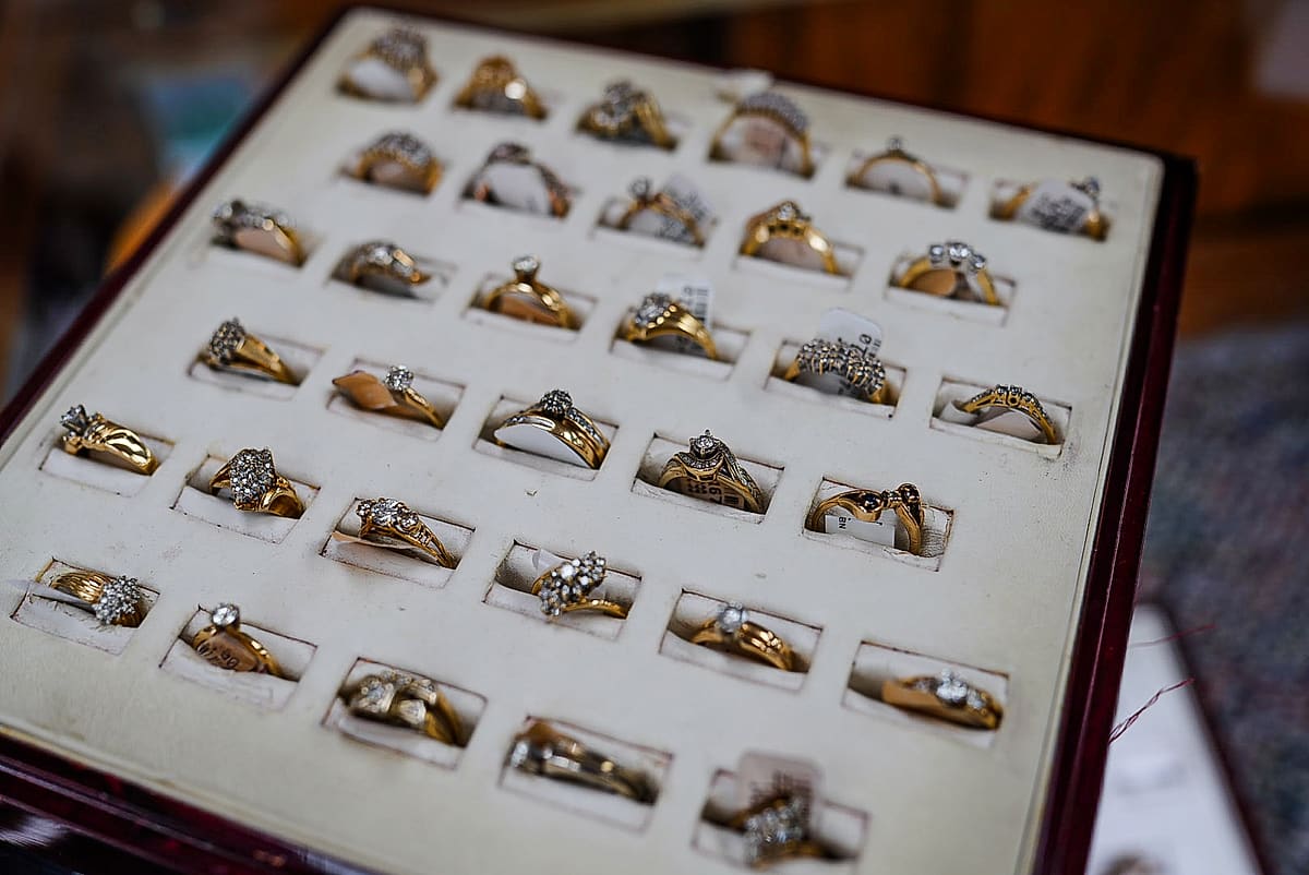 Display tray of gold and diamond rings at Frog's Pawn